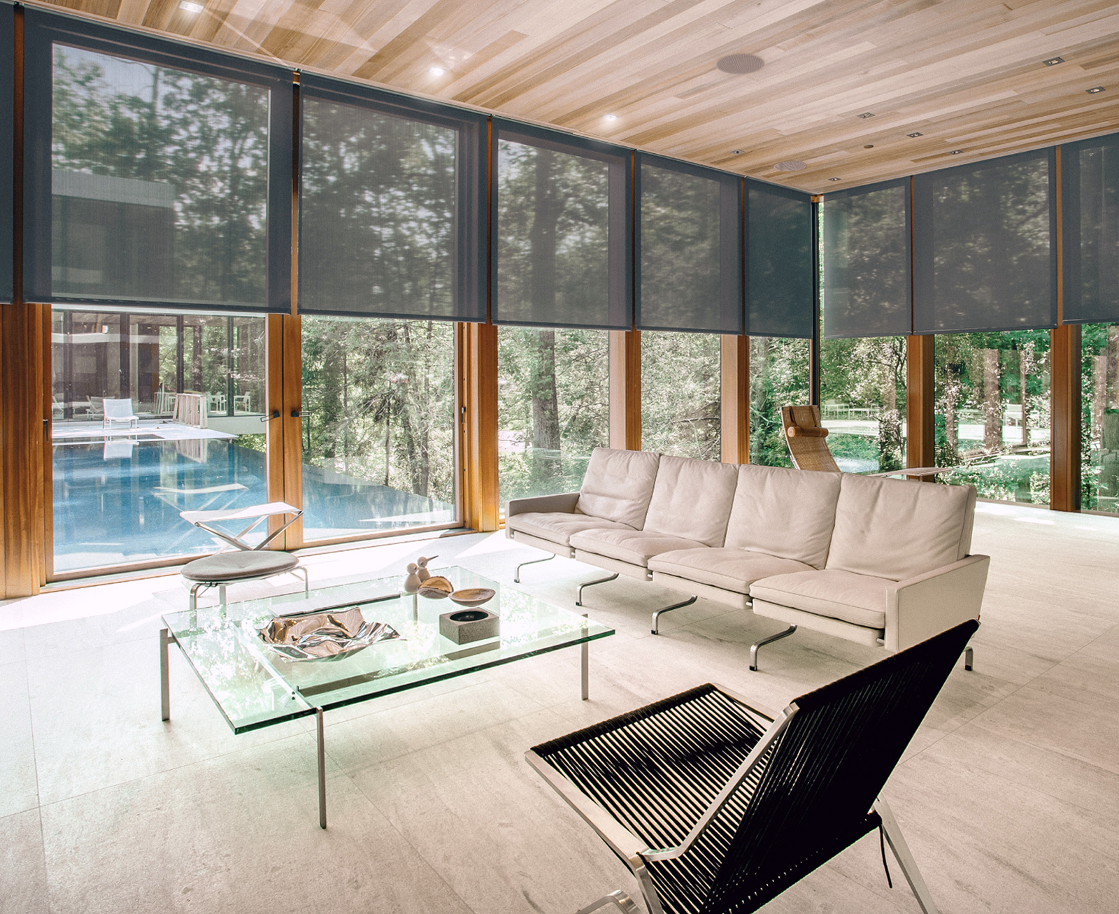 Time-lapse style image showing the same room throughout the day - morning sunlight, afternoon shade control, evening ambiance